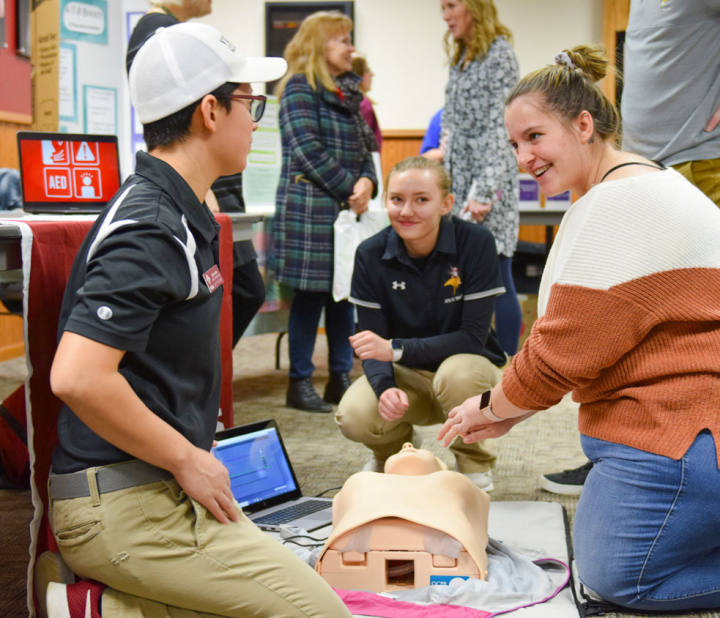 students practicing CPR
